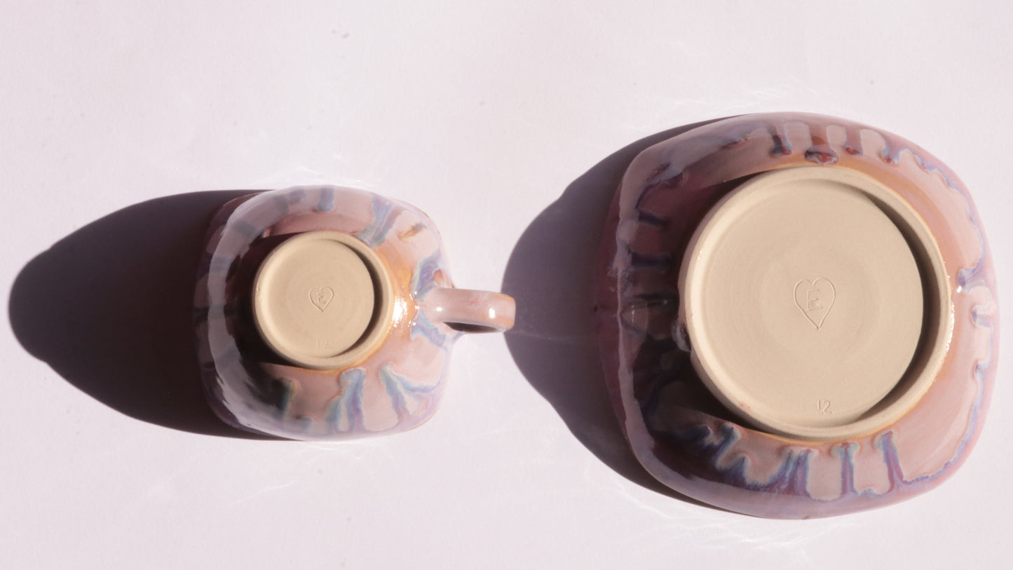 purple coffee cup and saucer with square rims on white background