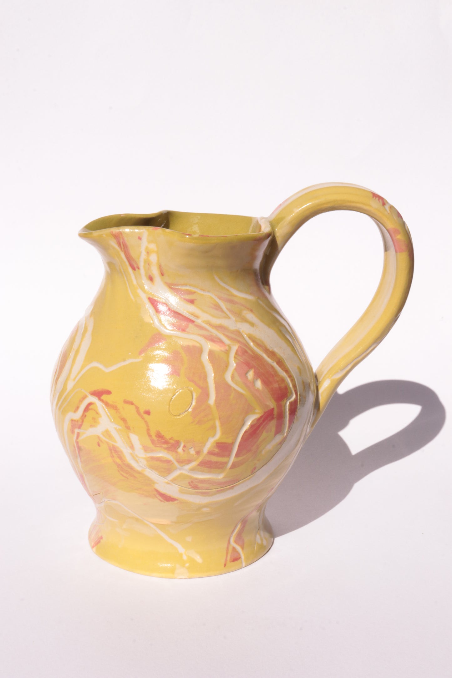 colourful engraved jug on white background