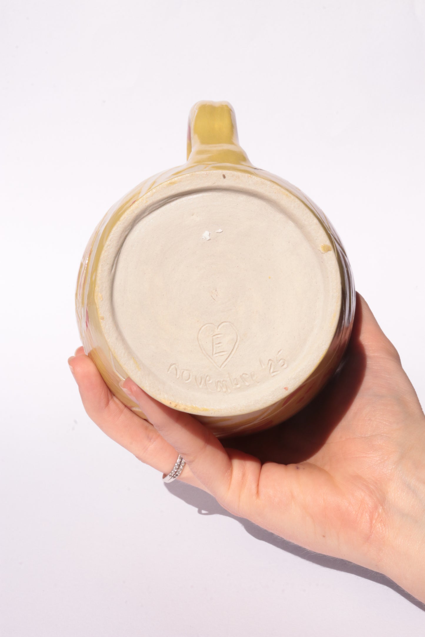 colourful engraved jug on white background
