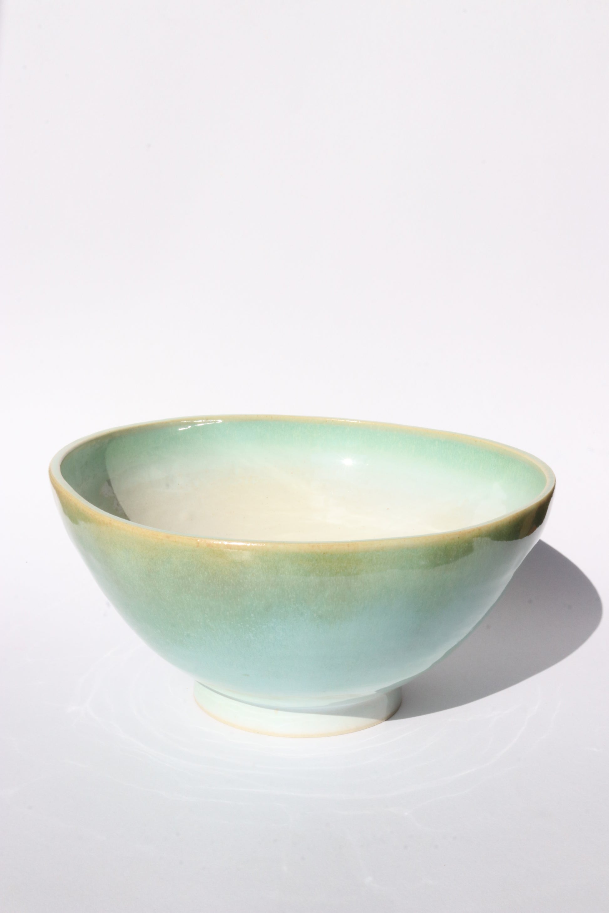 Ceramic bowl with a gradient color on a white background